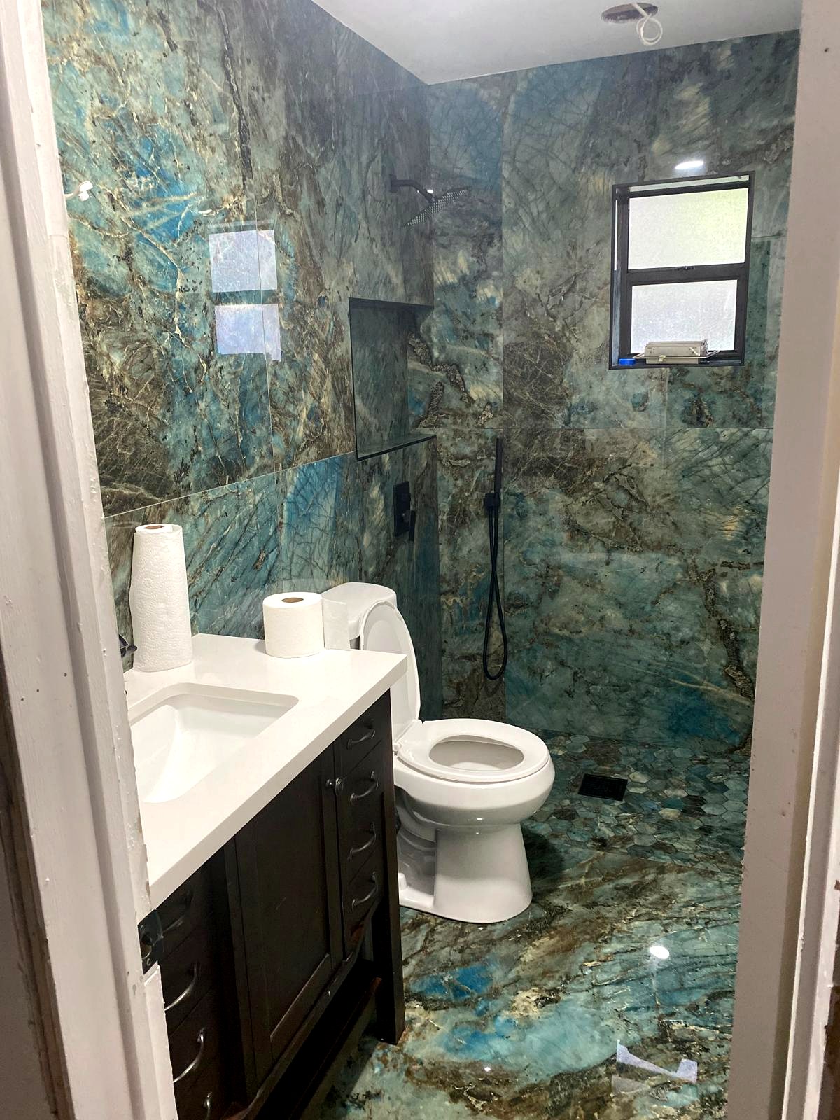 Contemporary bathroom with green tile accent