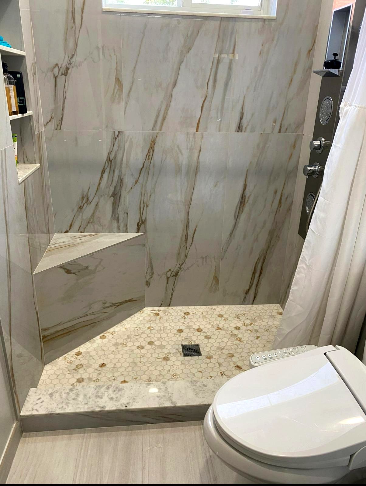 Full bathroom remodel, white tile and fixtures